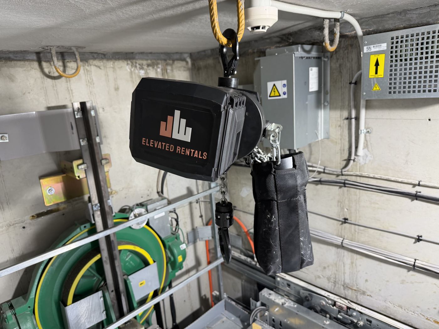 Elevated Rentals Yale chain hoist slung above lift machinery ready for a lift